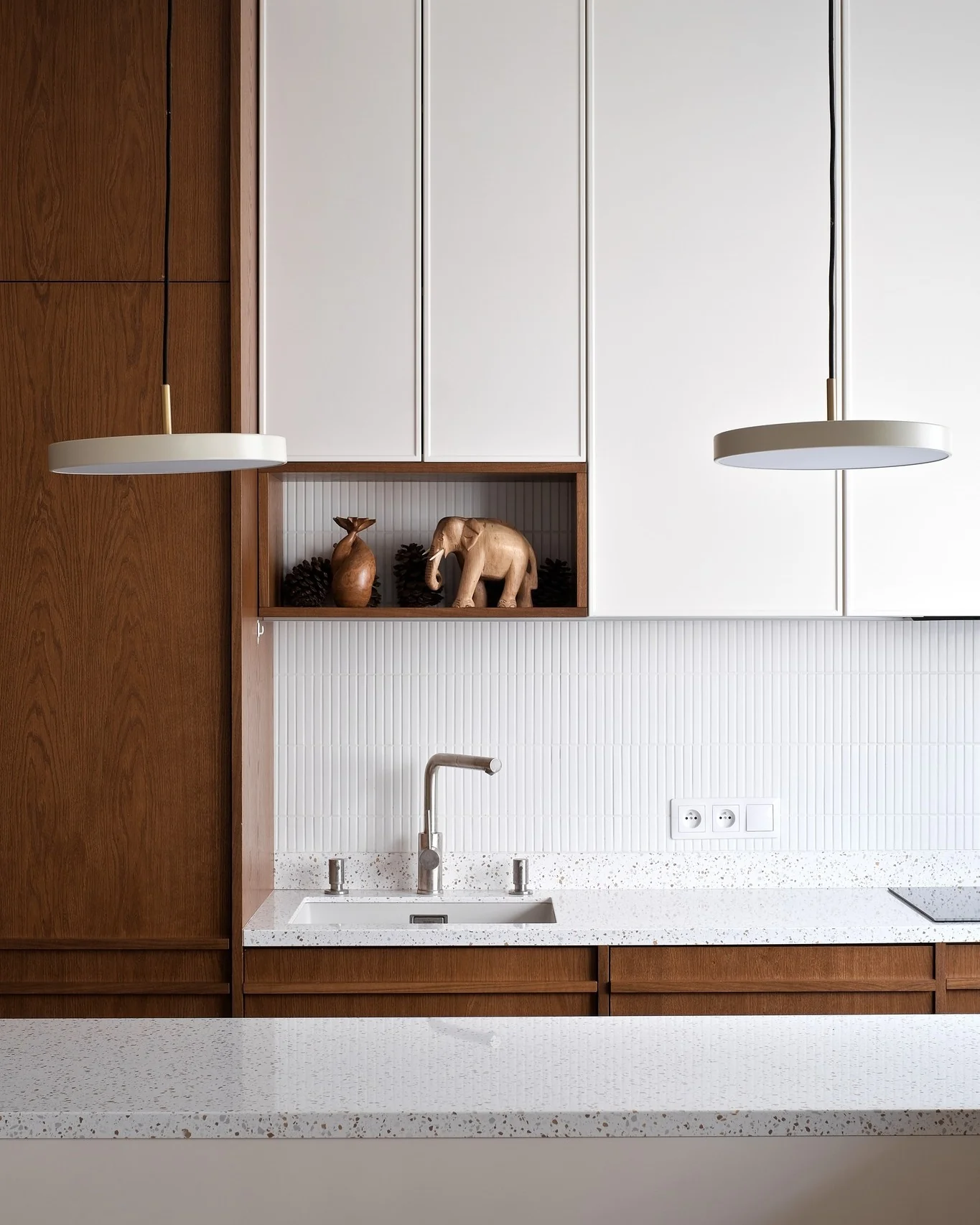 Wooden Niche Displays Sculptural Accents Above the Sink