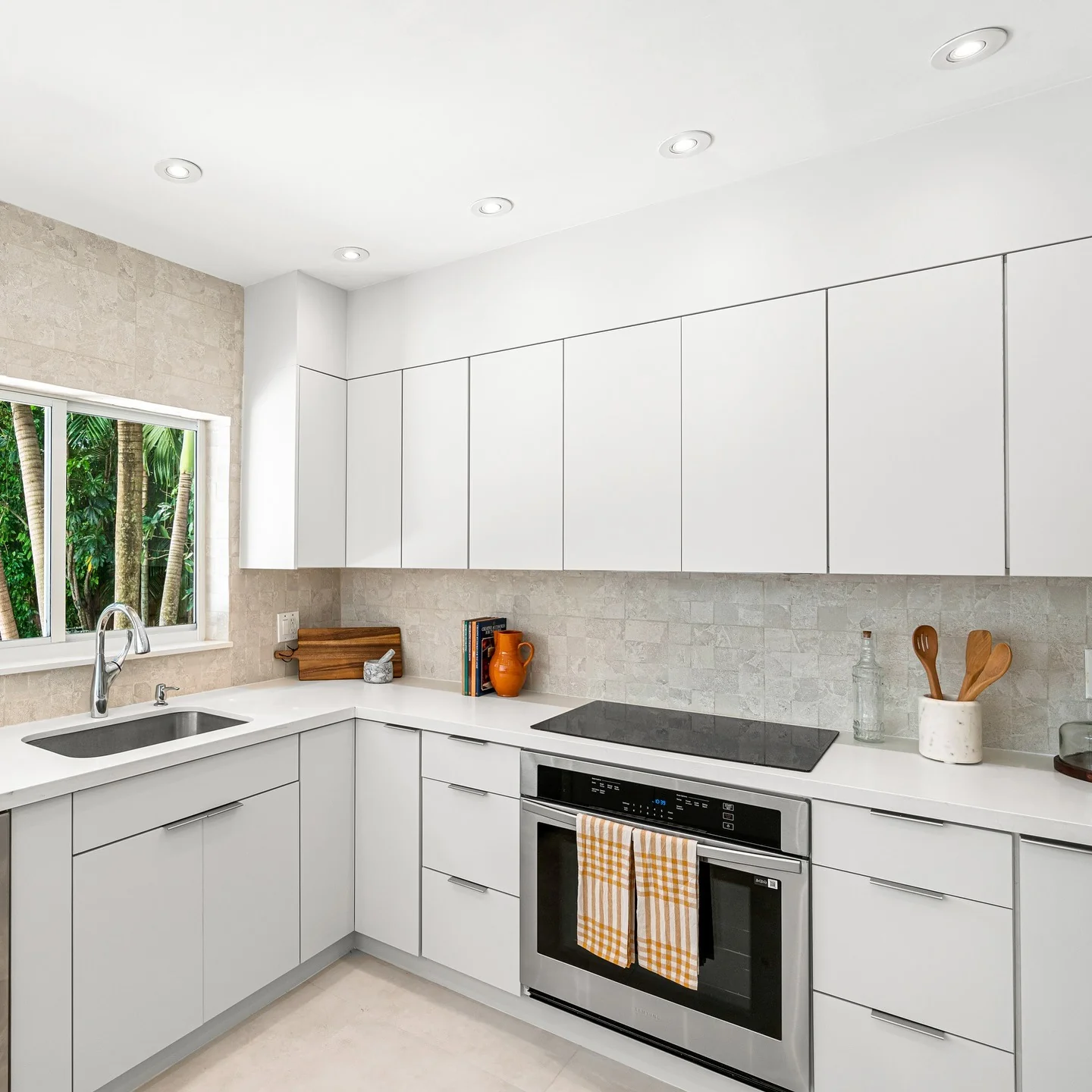 Textured Tile Adds Subtle Pattern to White Cabinets