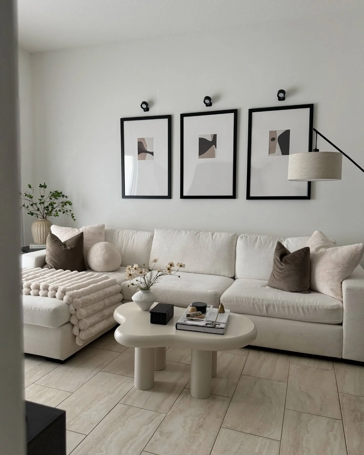 Abstract Art Prints Frame a Minimalist Living Room Focal Point