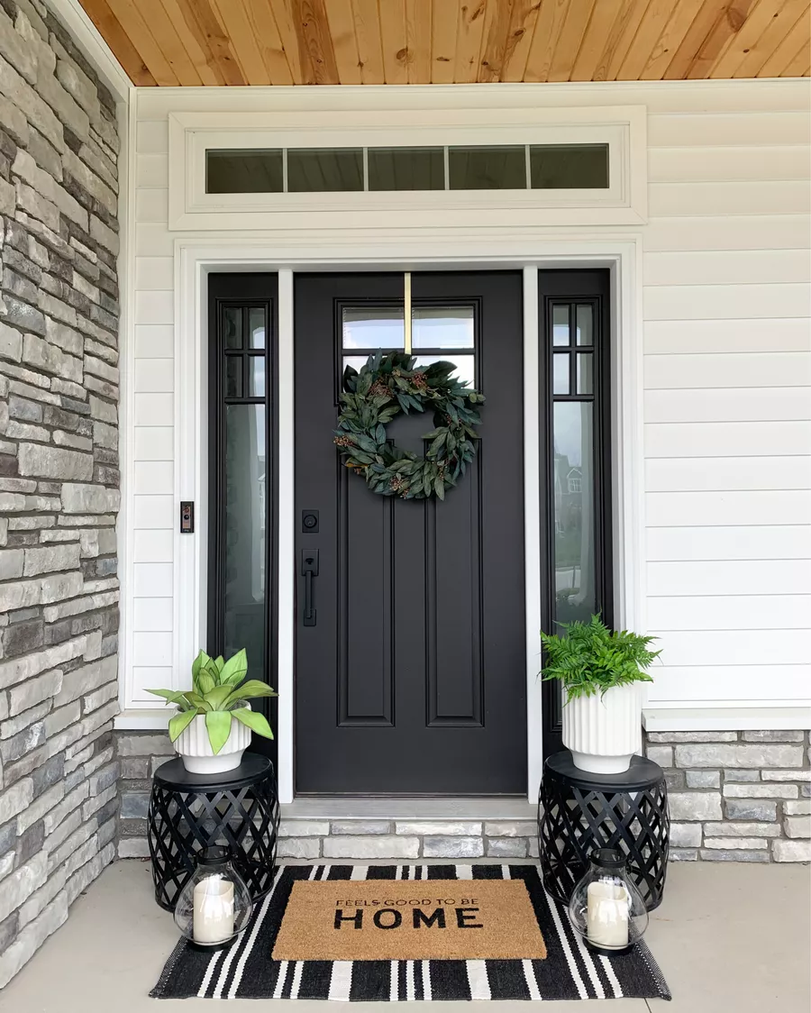 Black Lanterns and White Planters Flank Your Front Door