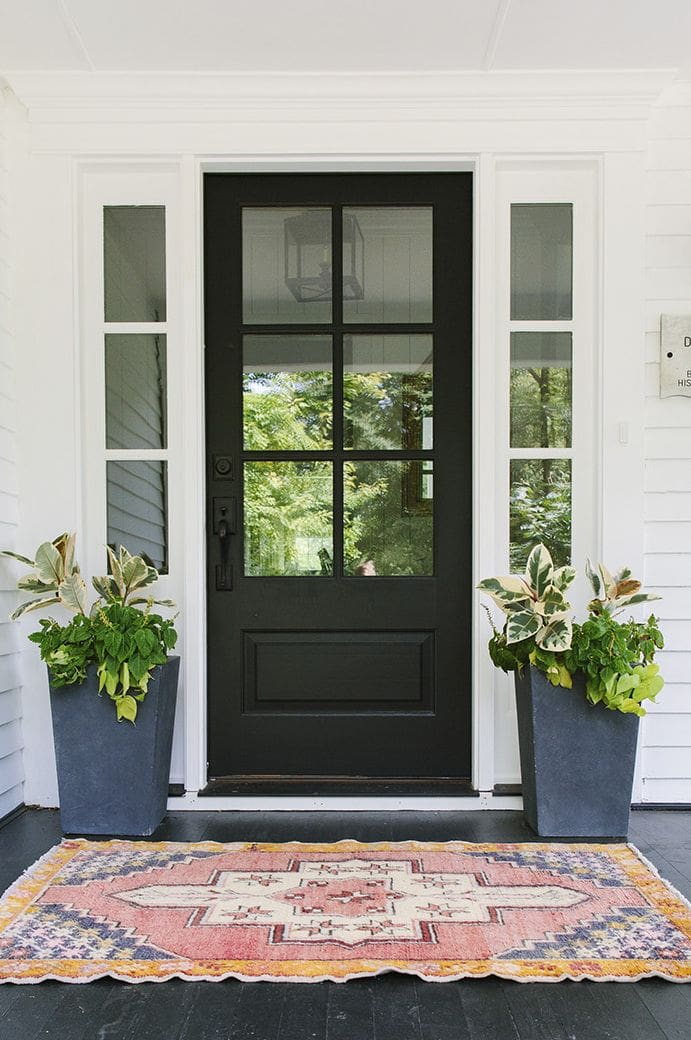 Tall Charcoal Planters Add Geometric Contrast to Black Door