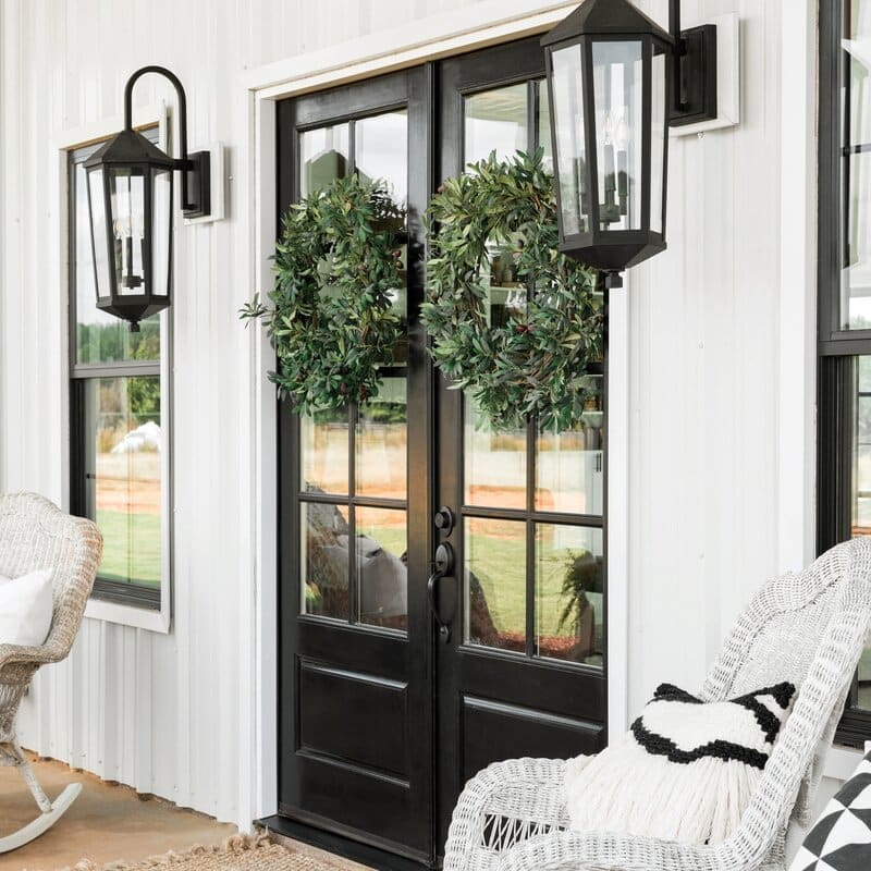 Symmetrical Olive Wreaths on Black French Doors