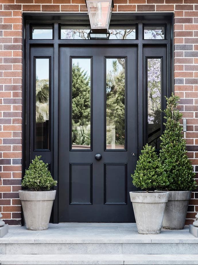 Tapered Concrete Planters Frame Your Black Doorway