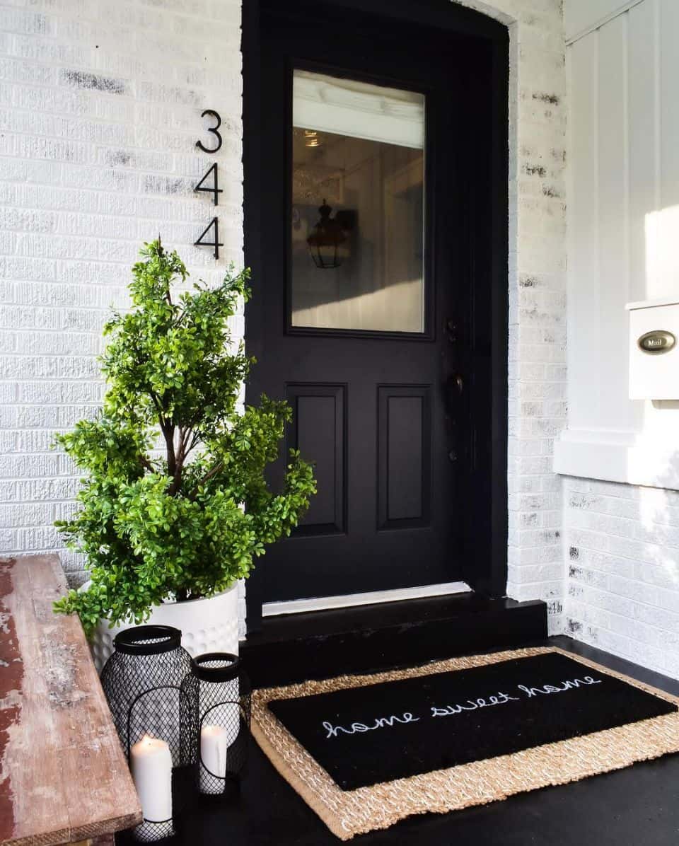 Vertical House Numbers Create a Clean Line on White Brick