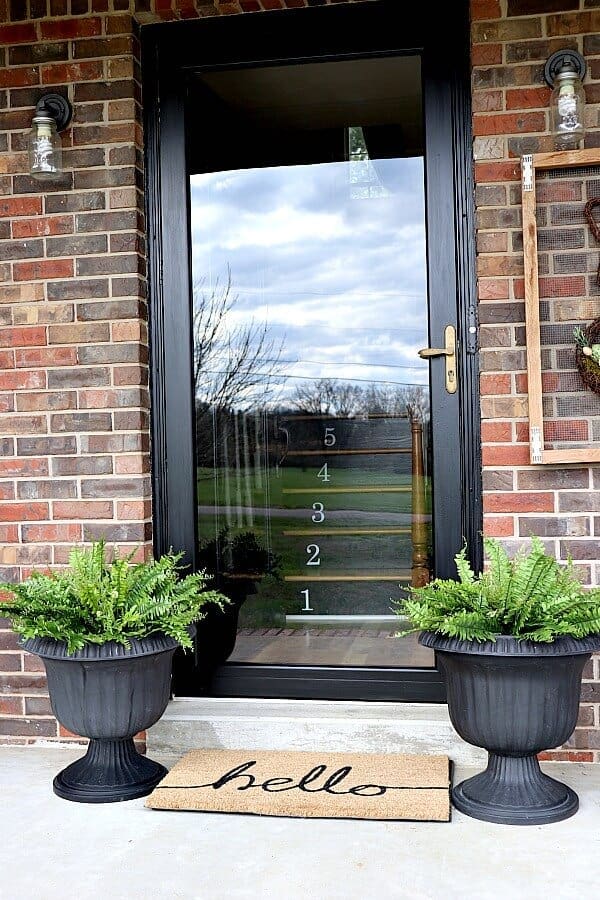 White Vertical House Numbers on Black Door Glass
