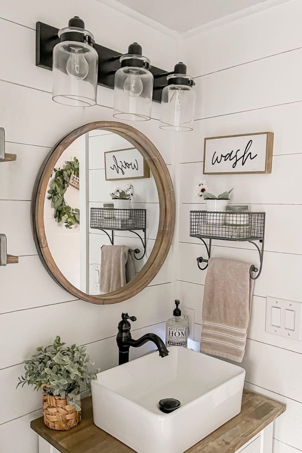 Mount a wire mesh shelf with a towel bar for compact storage
