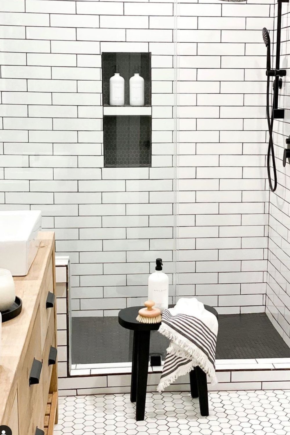 Dual Shower Niches With Hex Tile Accent Break Up White Subway Tile