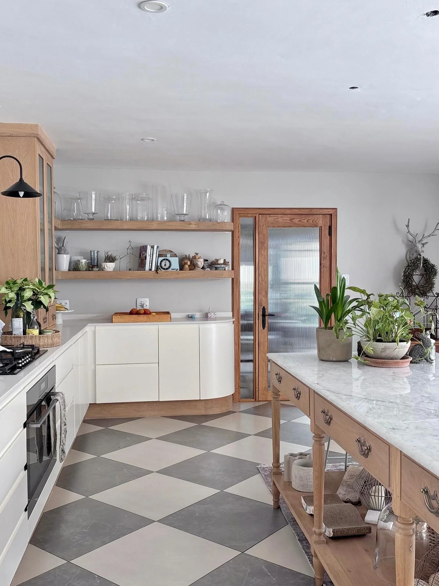 Style Shelves with Varying Heights of Glass Vases