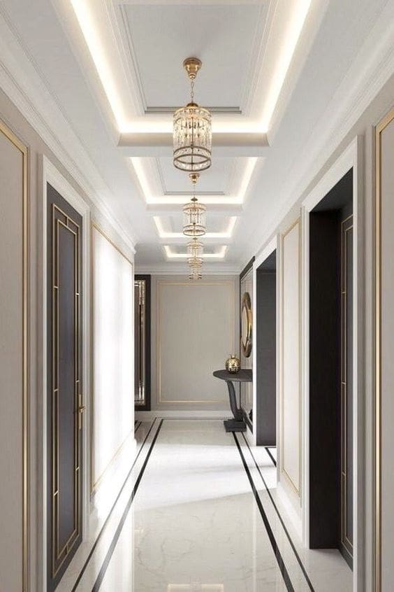 Tiered Tray Ceiling With Crystal Lanterns Creates a Dramatic Hallway