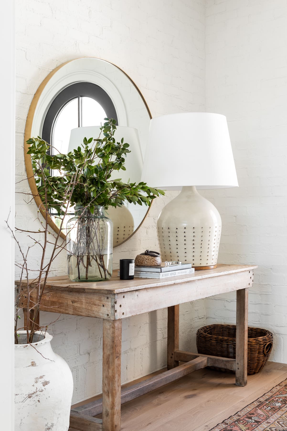 Large Glass Vase Holds Lush Greenery and Branches