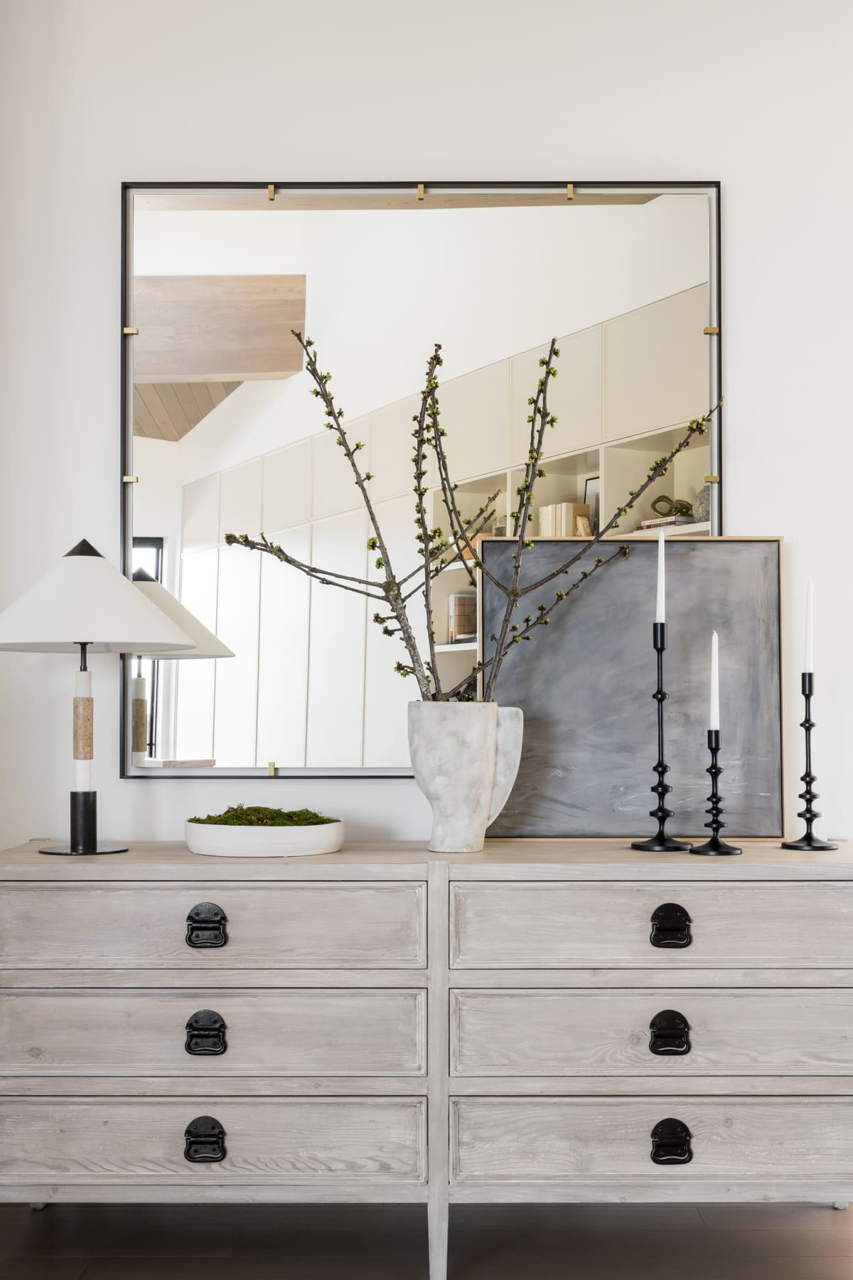 Grouped Black Candlesticks Add Vertical Interest to Console