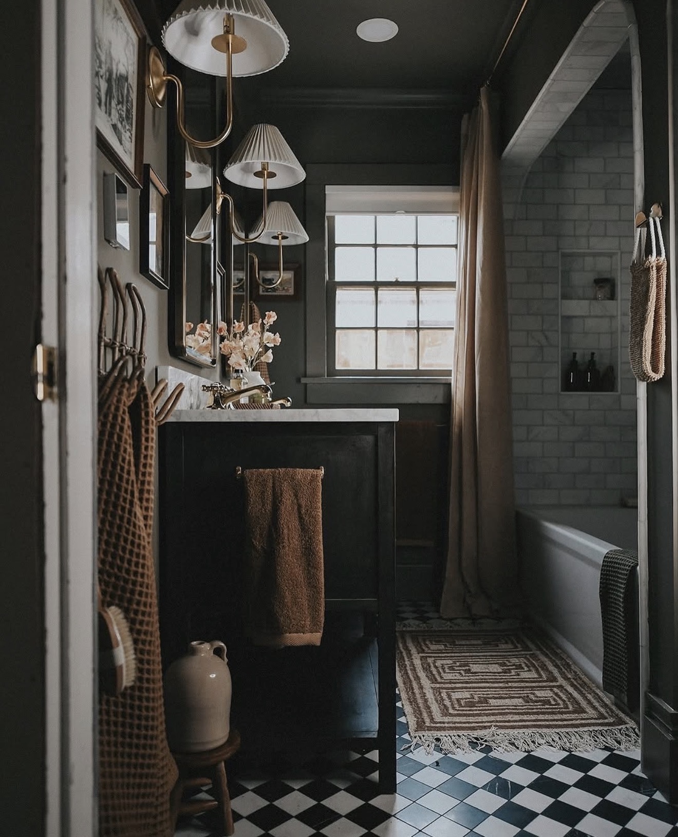 Pleated Sconces Cast Soft, Moody Light Above the Vanity