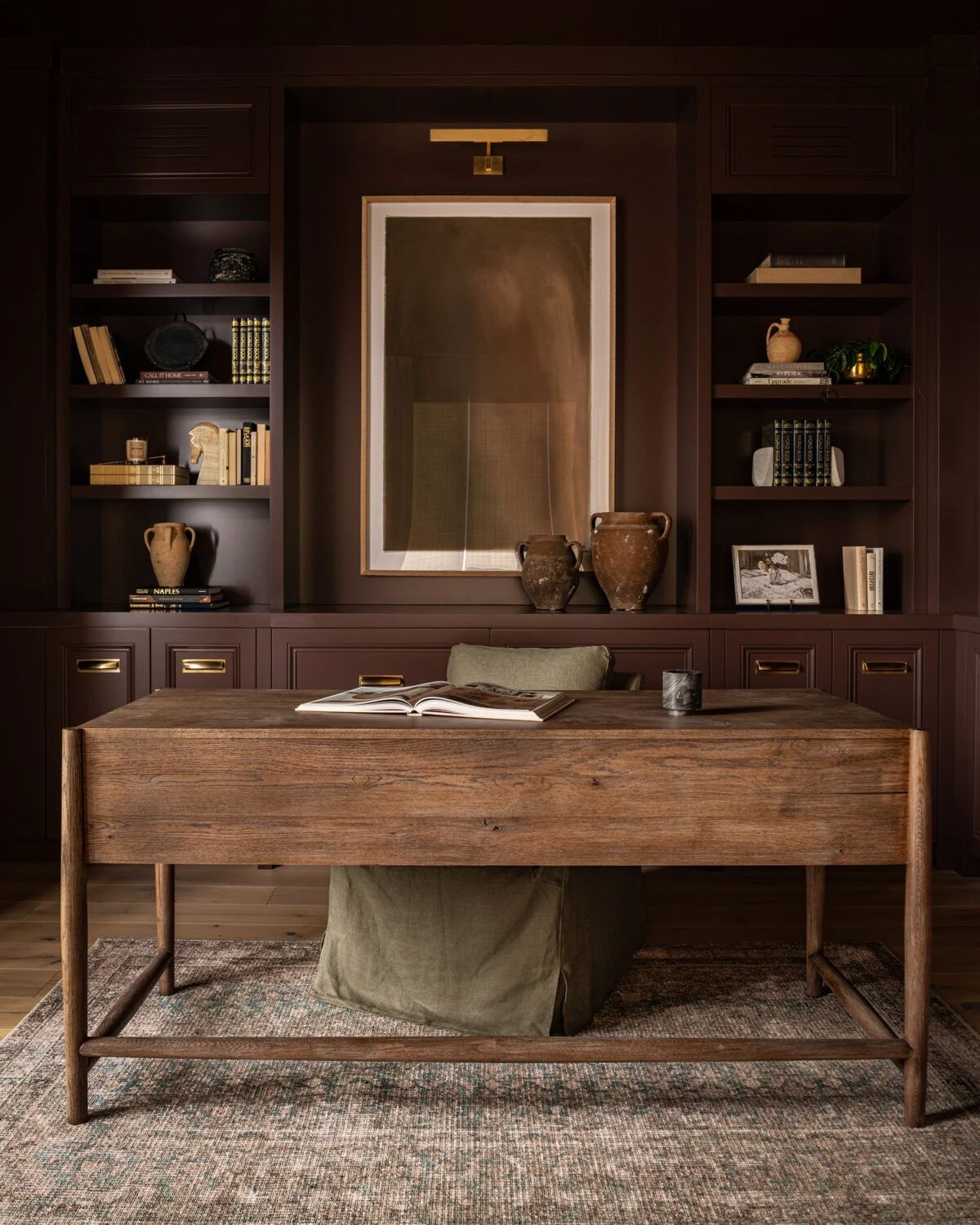 Layered Artwork and Vases Create a Rich Focal Point