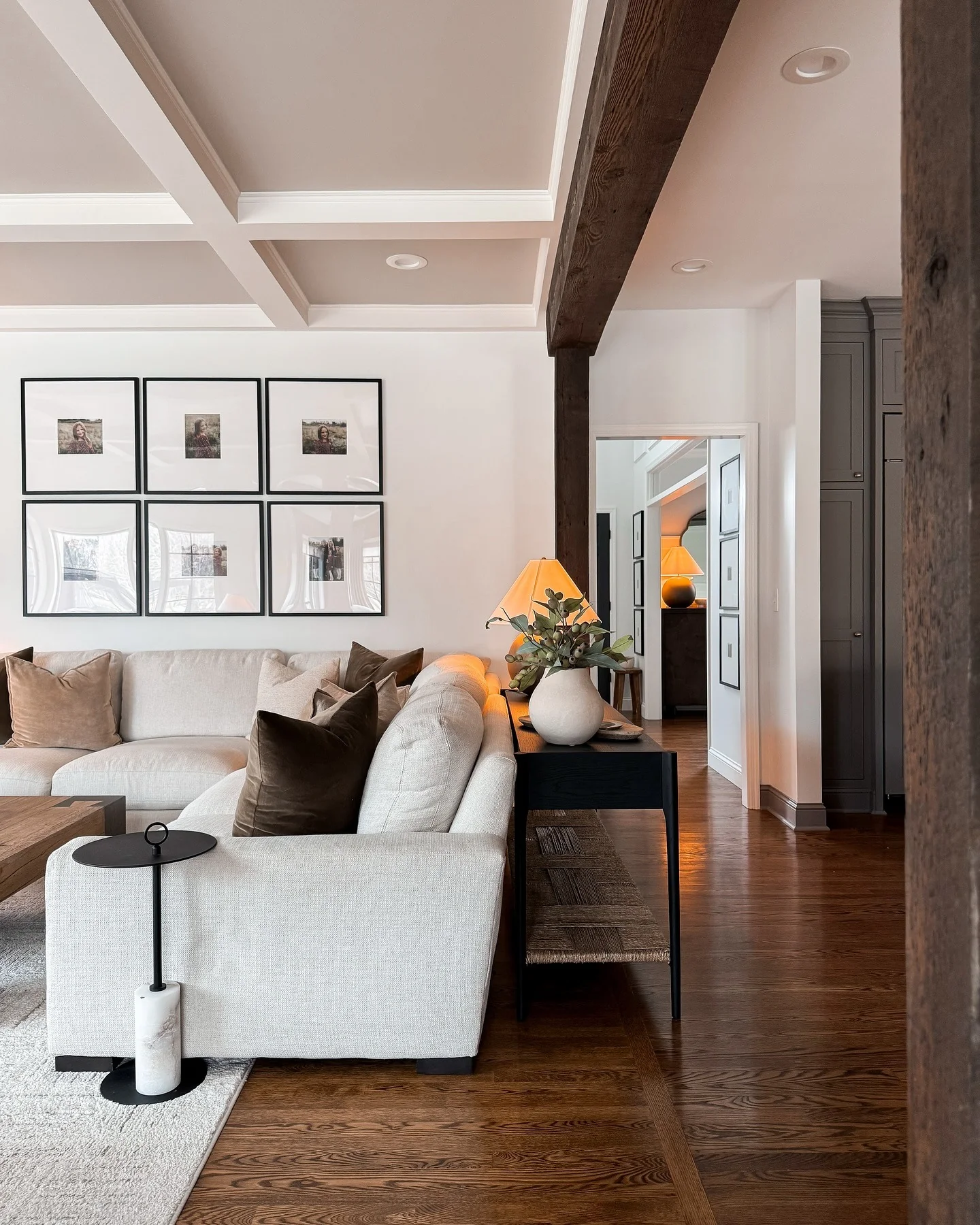 Gallery Wall of Black-Framed Photos Adds Personal Touch
