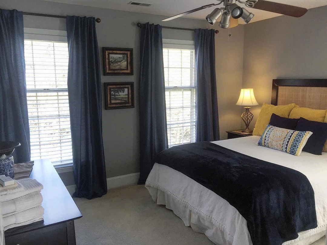Navy Blue Curtains Frame Windows With Natural Light