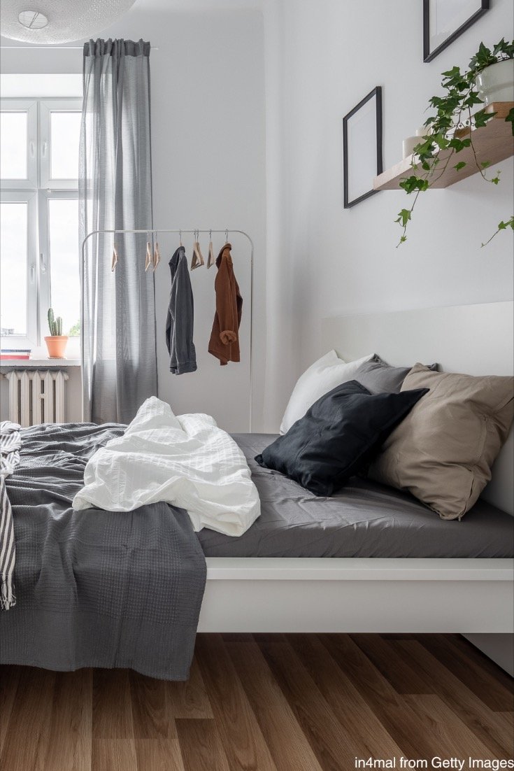 Garment Rack Adds Open Storage Next to Bed