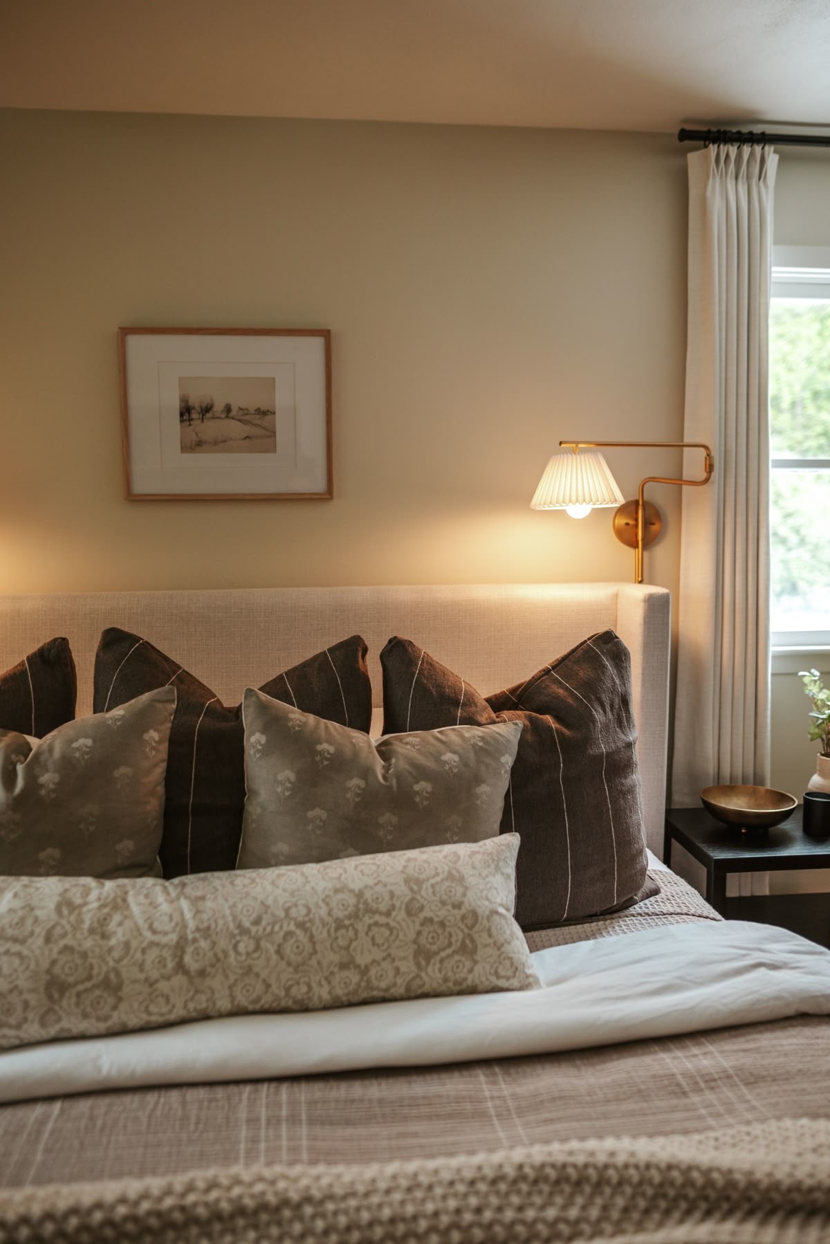 Layered Pillows Create A Cozy, Textured Headboard
