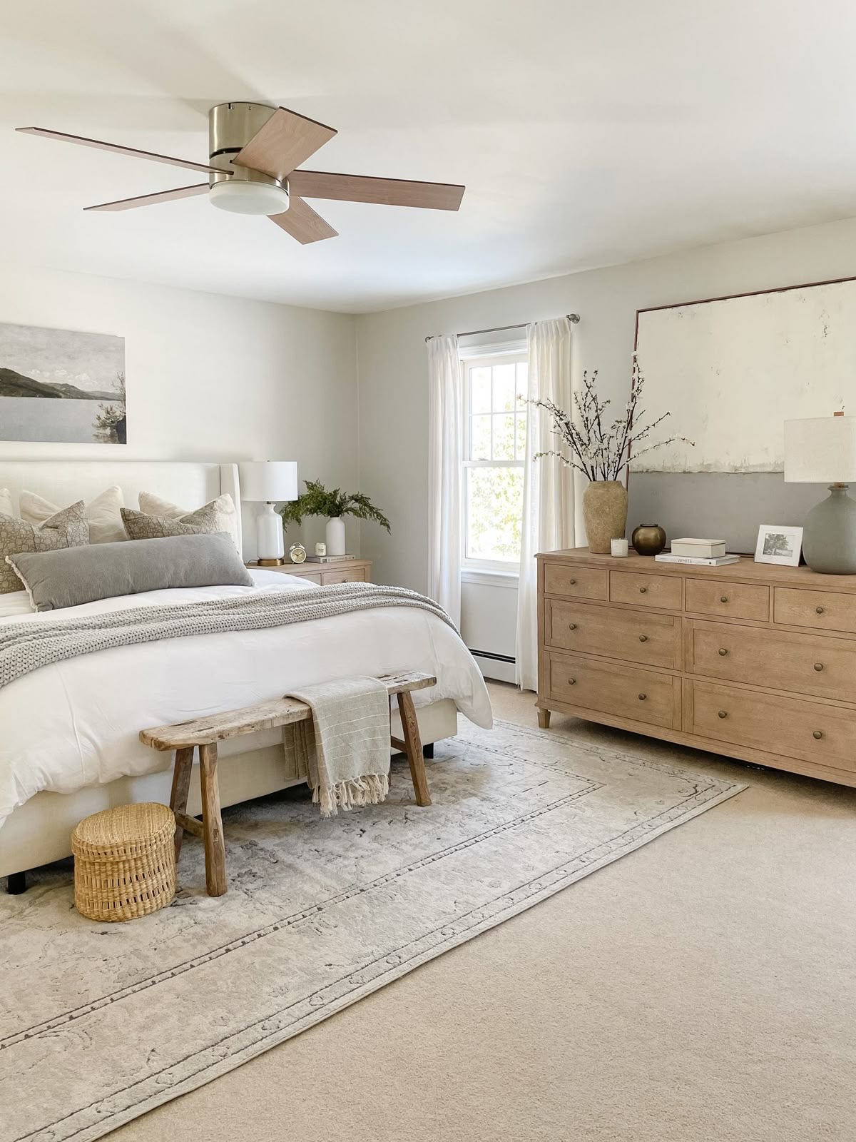 Wooden Dresser Anchors Bedroom With Subtle Two-Tone Wall Art