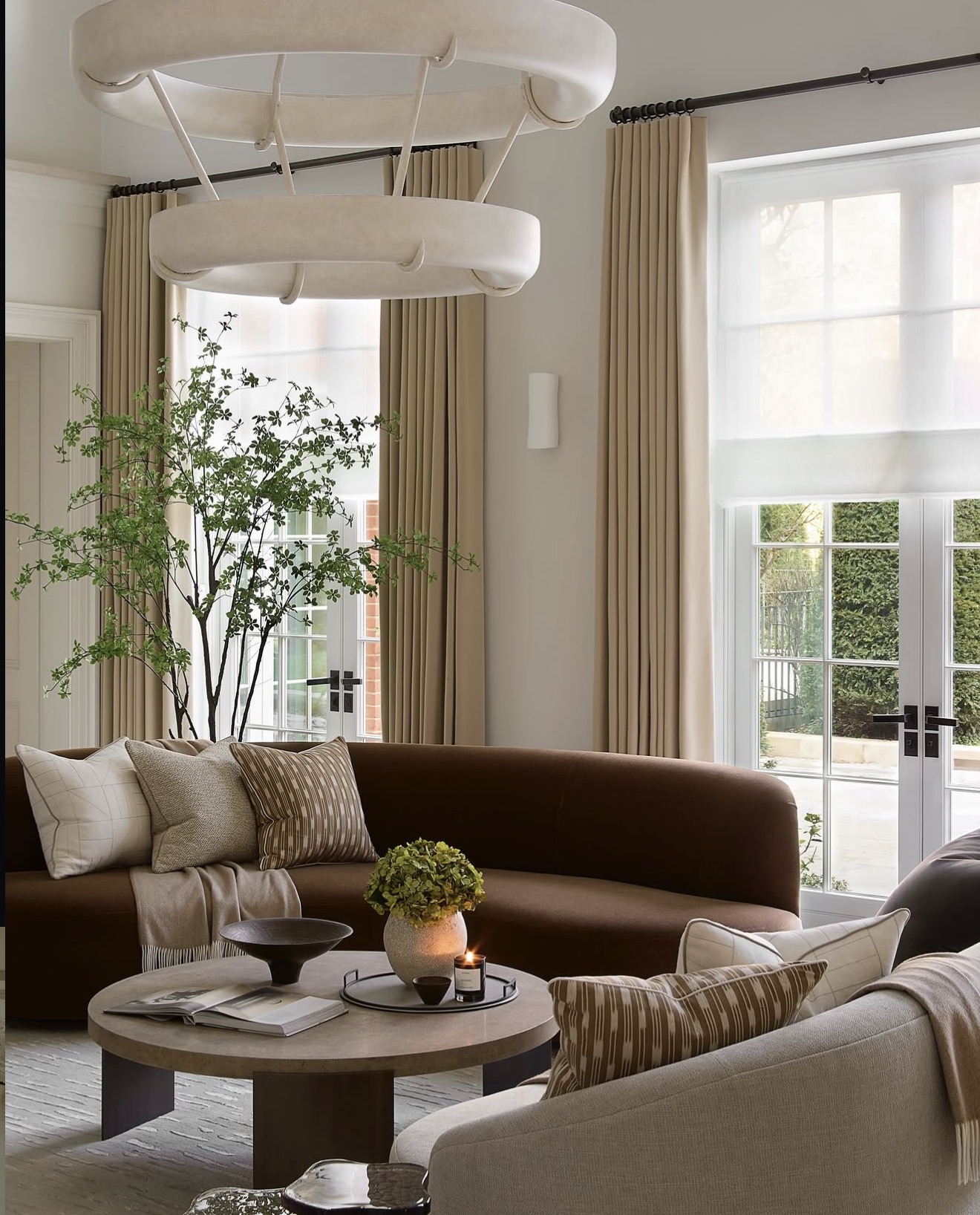 Curved Sofa With Contrasting Pillows Creates a Cozy Nook