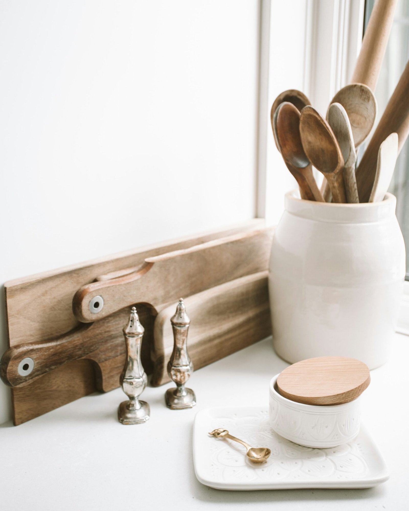 Group Wooden Utensils in a Ceramic Crock