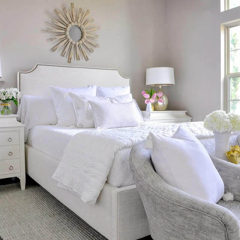 Sunburst Mirror Adds a Dramatic Focal Point Above the Bed