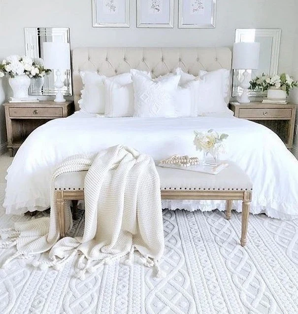 White Upholstered Bench Adds Softness at Bed