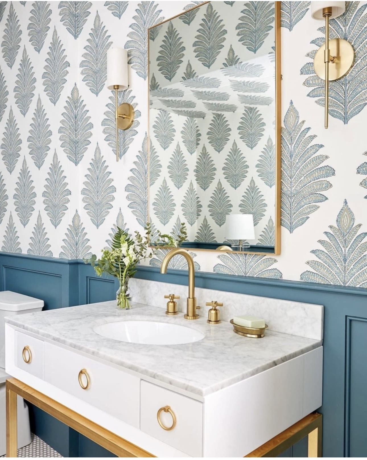 Patterned Wallpaper Creates a Serene Backdrop for Brass Fixtures
