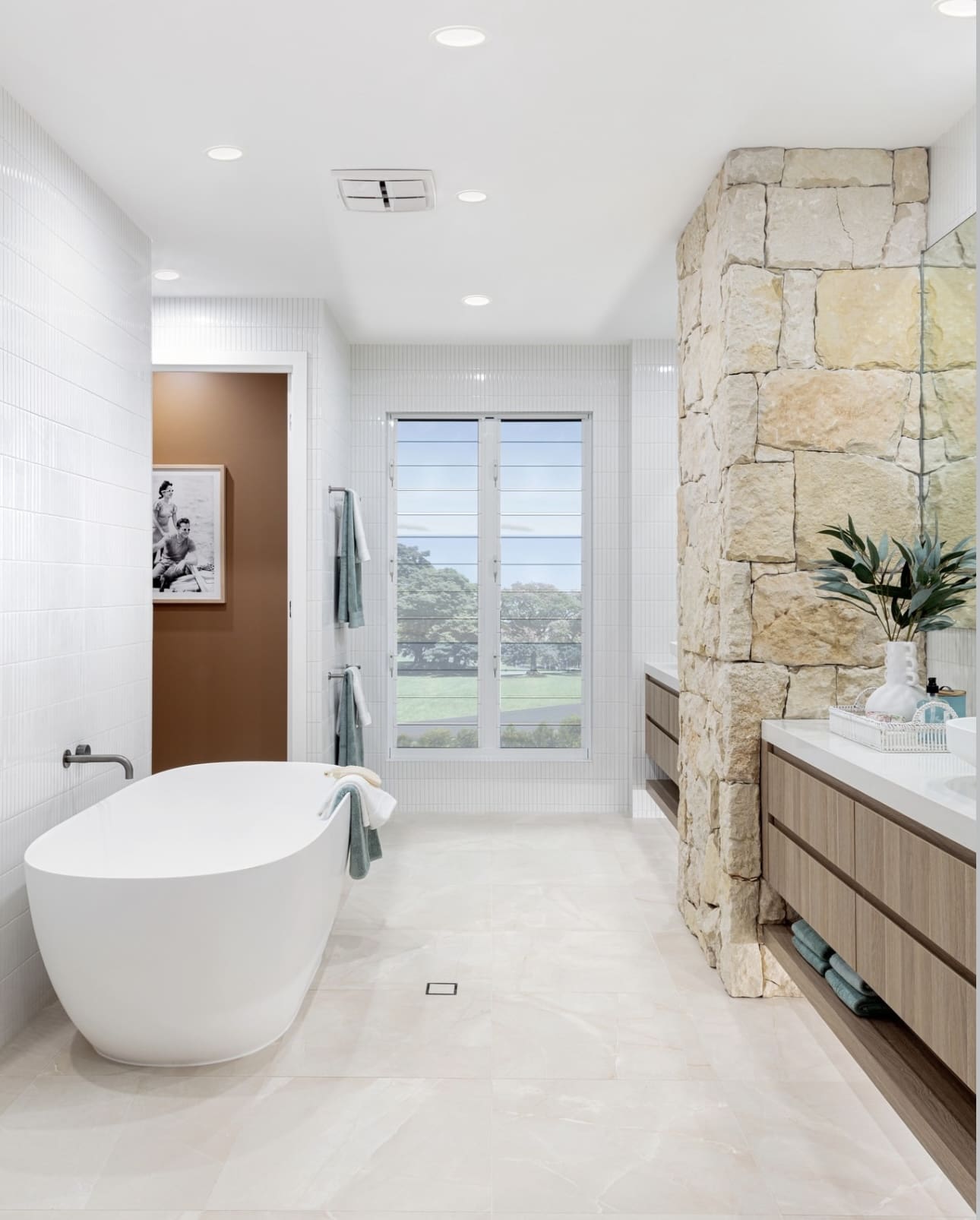 Anchor the Vanity Area With a Textured Stone Pillar