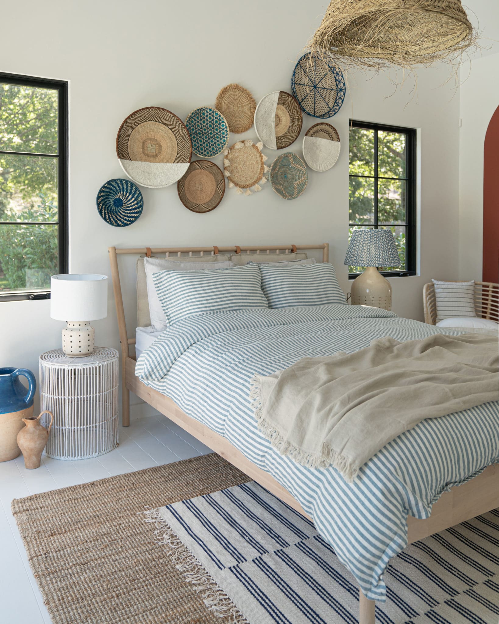 Woven Wall Plates Add Organic Texture Above the Bed