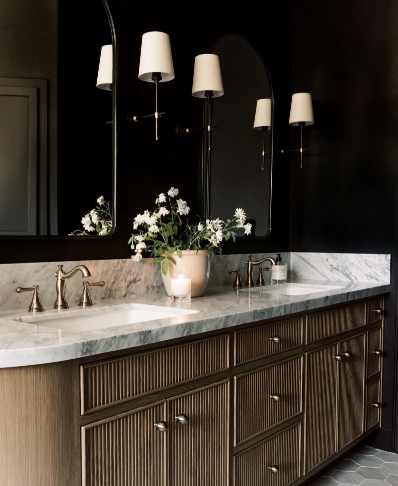 Fluted Wood Vanity with Brass Hardware Adds Warmth