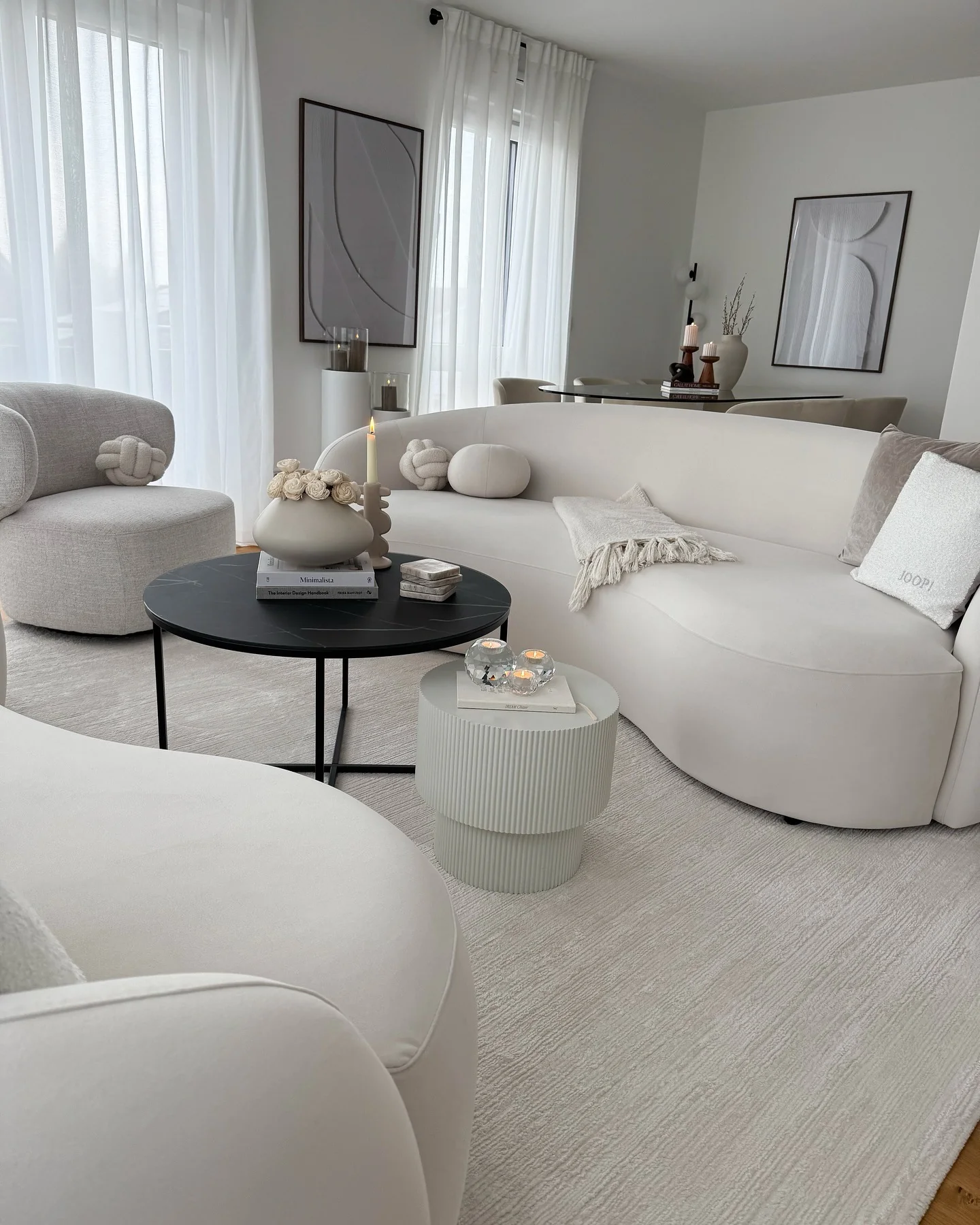 Soften the Look with a Curved Sofa and Textured Throw