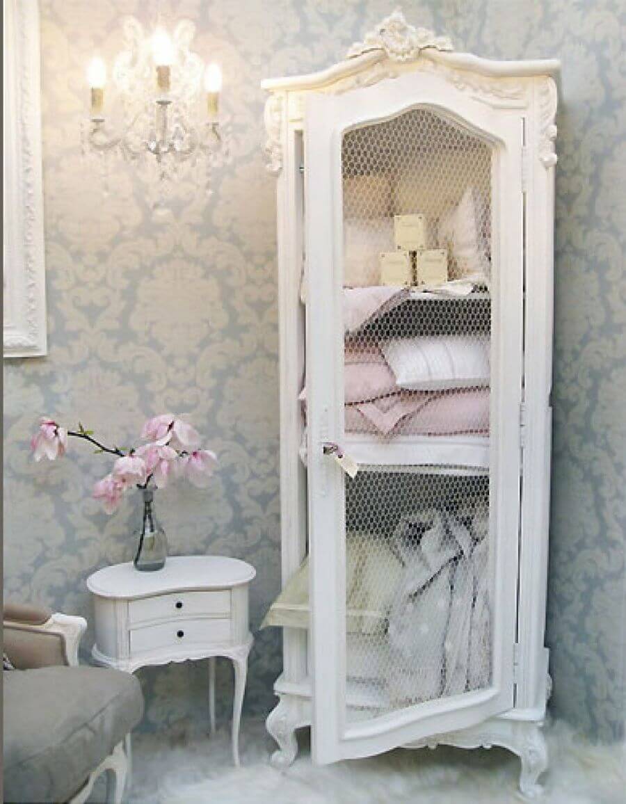 White Armoire With Mesh Doors Hides Clutter