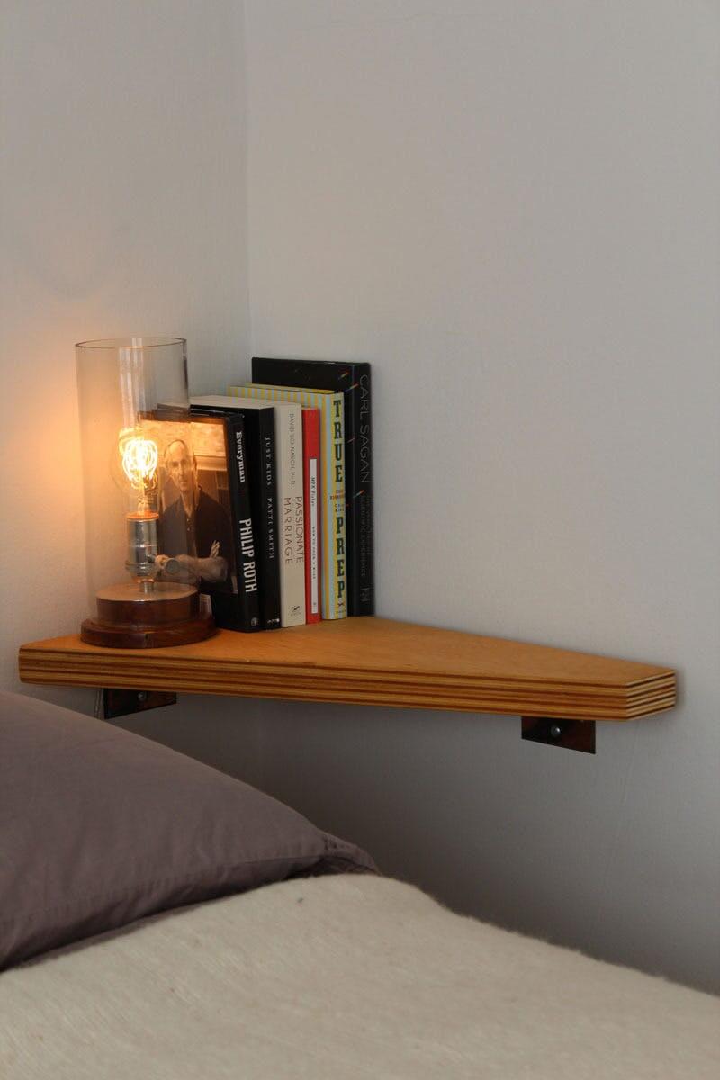 Mount a Simple Shelf Above Your Bed for Essentials