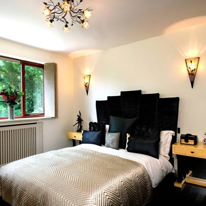 Segmented Black Headboard Adds Geometric Drama