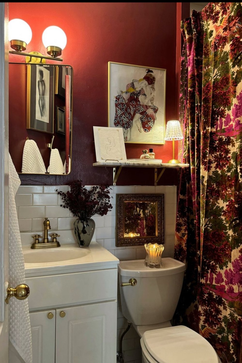 Framed Woodland Scene and Candle Create a Cozy Vignette