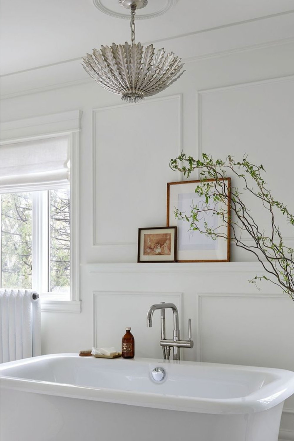 Frame Artwork and Branches Add a Natural Touch to a Shelf