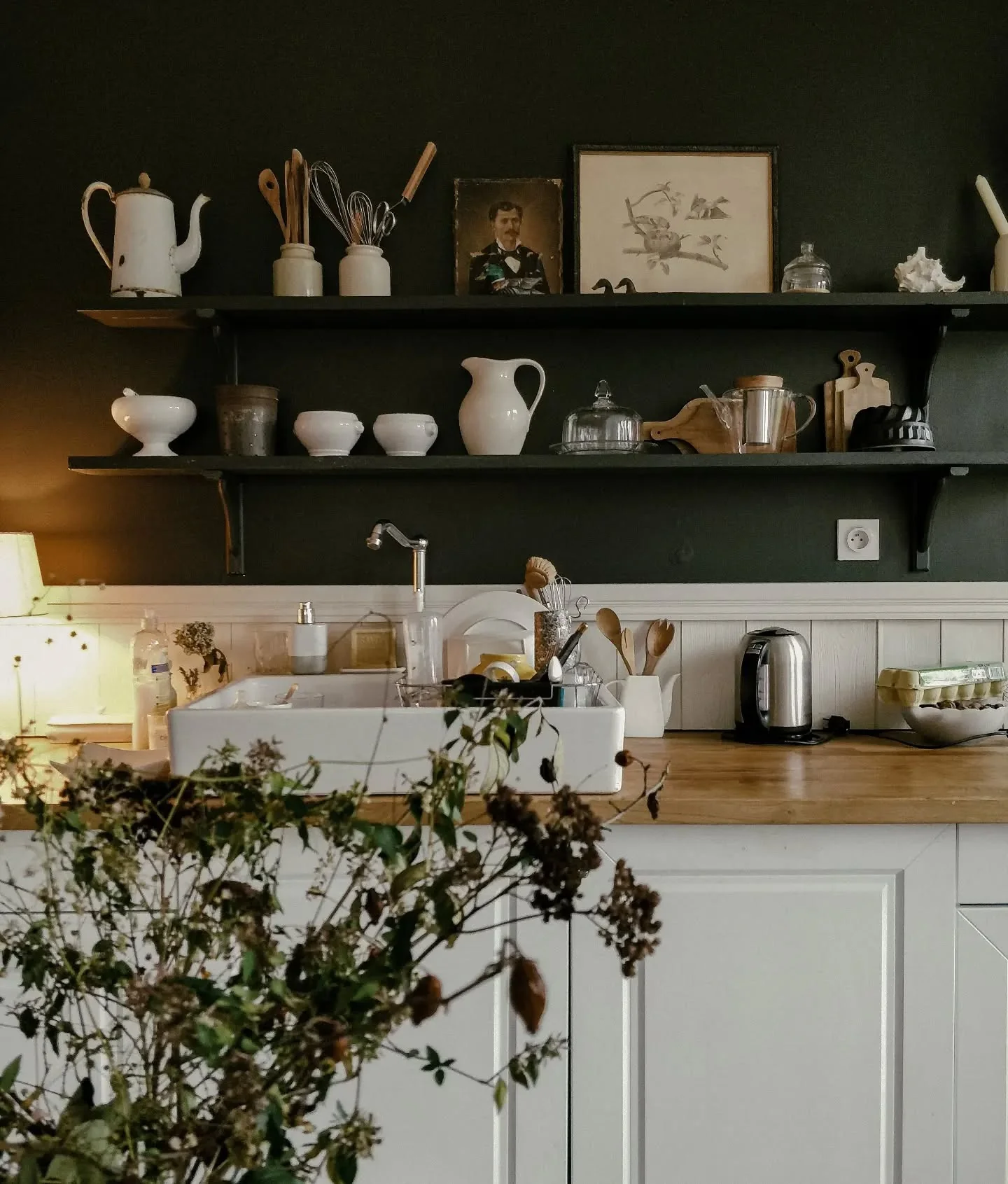 Vintage Portraits Add Character to Dark Shelving