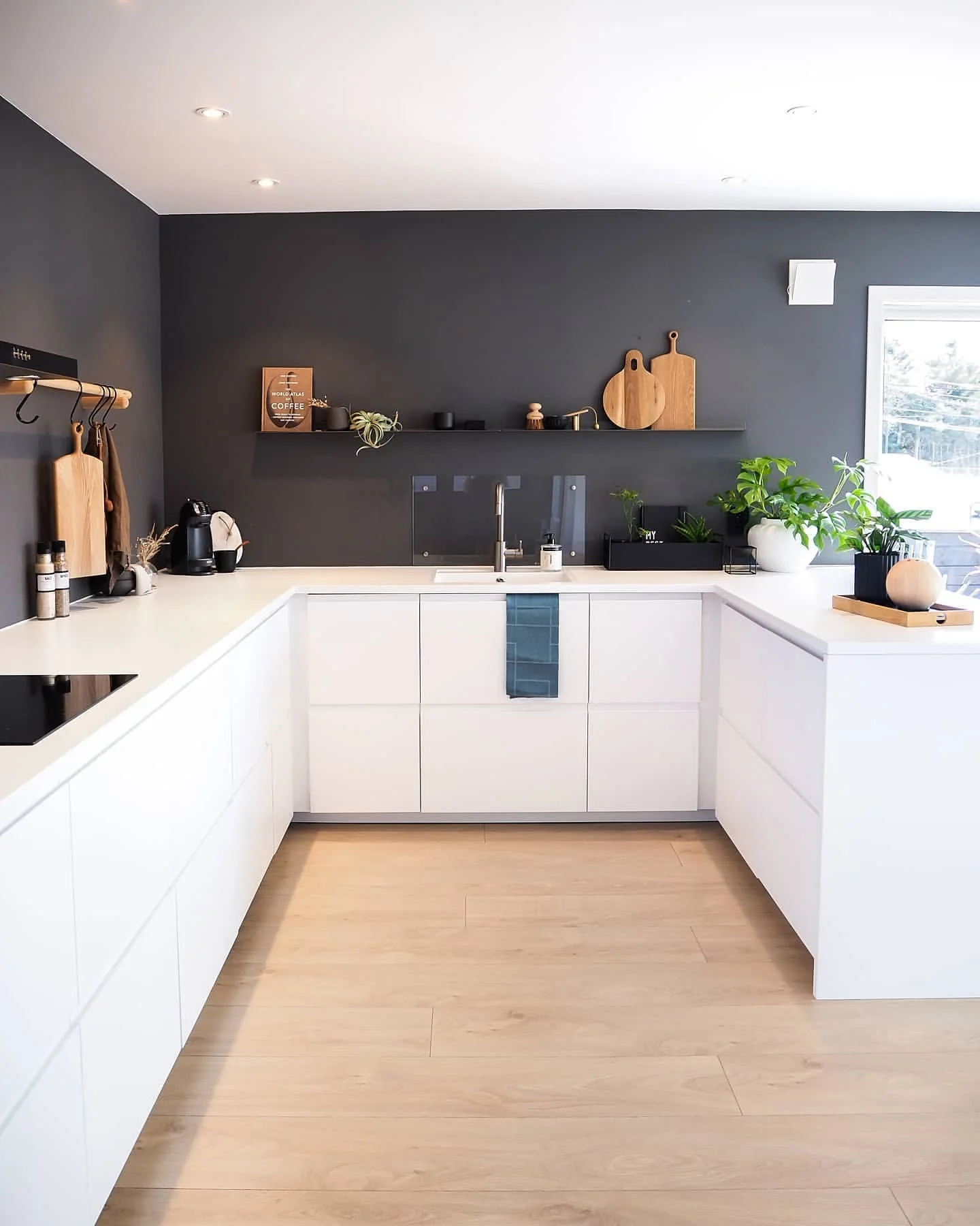Wooden Cutting Boards Add Natural Warmth to Dark Walls