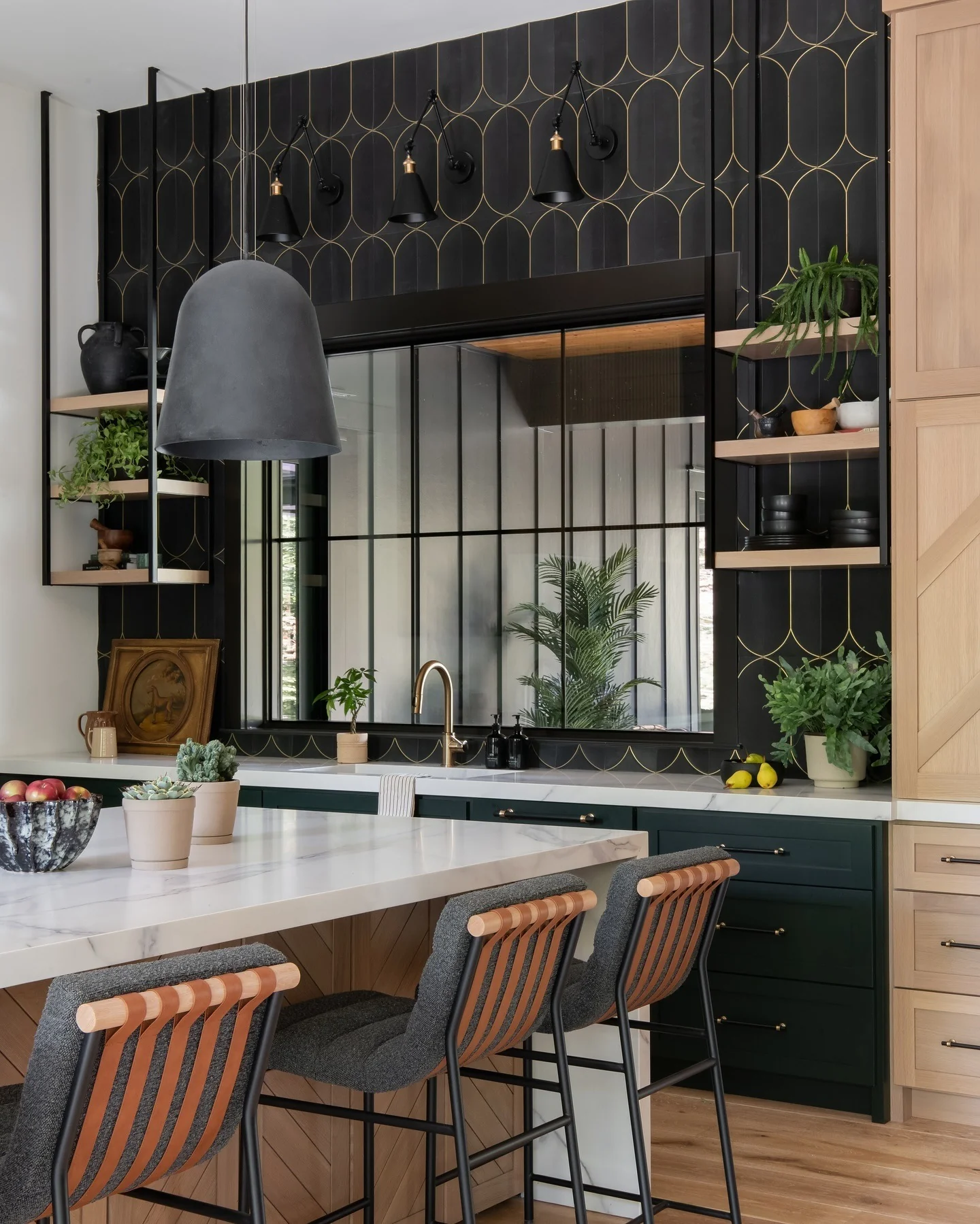 Geometric Arches Add Glamour Above Dark Green Cabinets