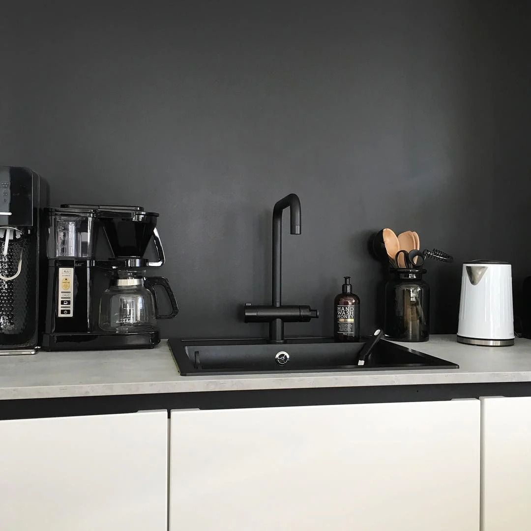 Contain Countertop Clutter with a Dark Glass Jar