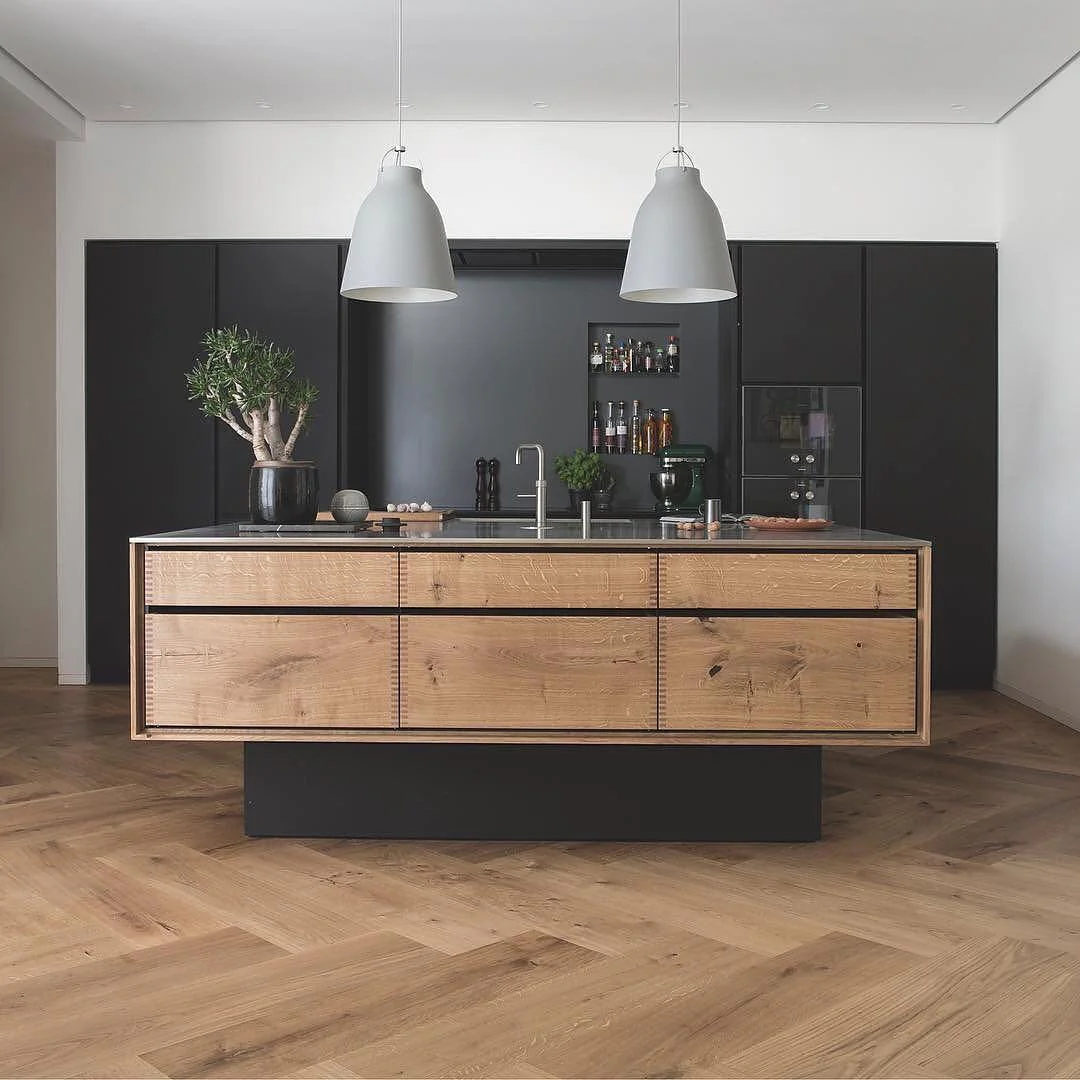 Warm Wood Drawer Fronts Contrast Beautifully with Matte Black Walls