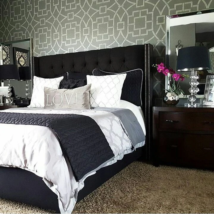 Geometric Stencil Wall Adds Pattern to a Black and Grey Bedroom