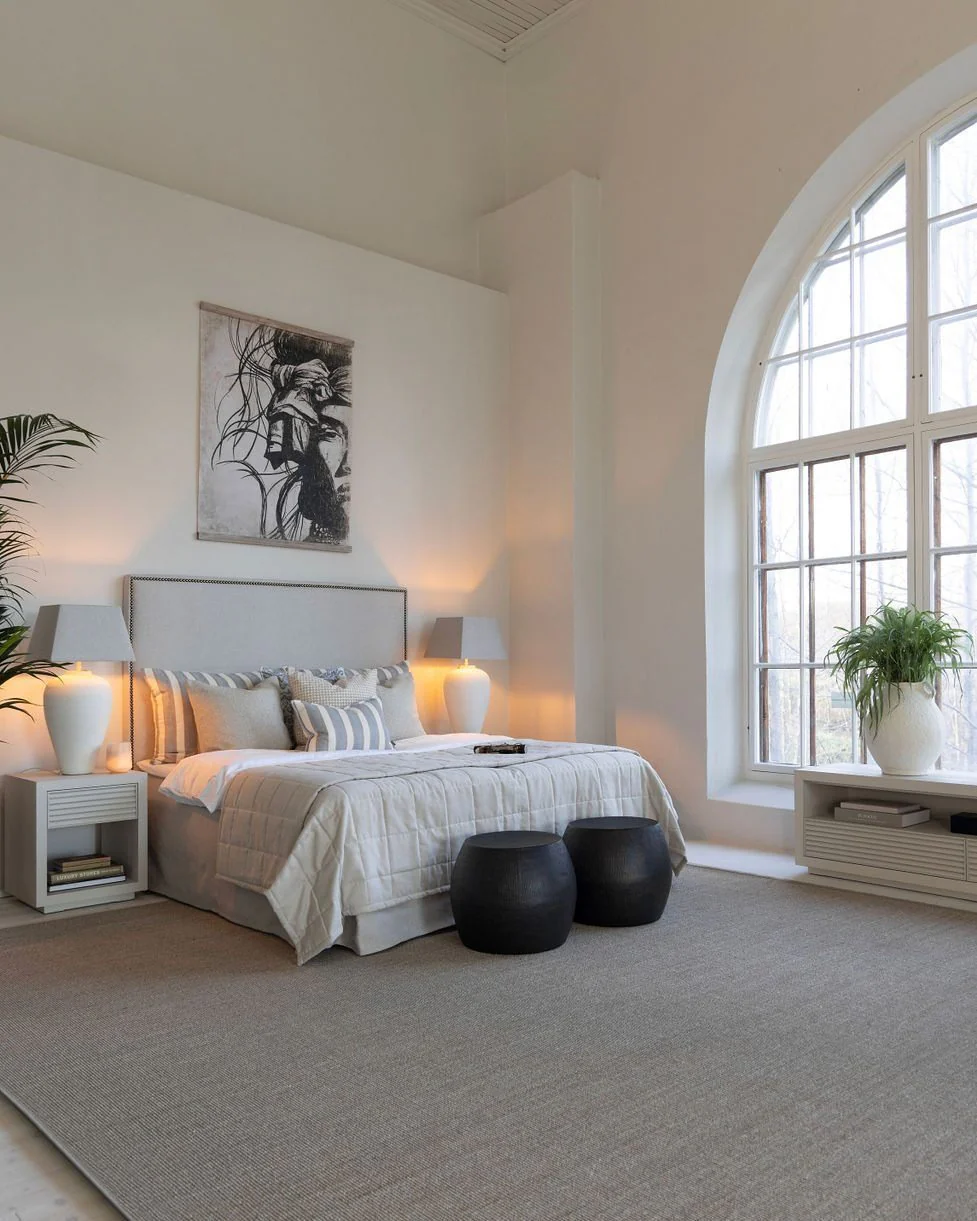 Dark Round Poufs Ground the Foot of the Bed