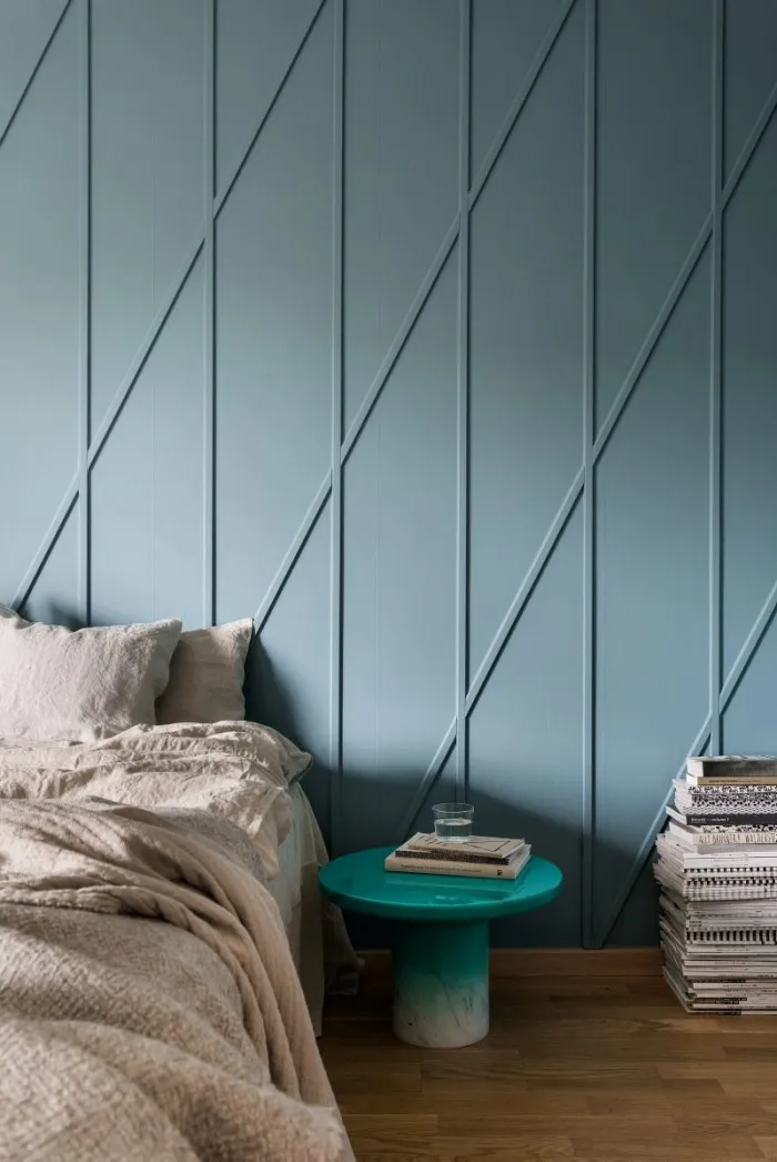 Diagonal Trim Creates a Geometric Pattern on a Blue Wall