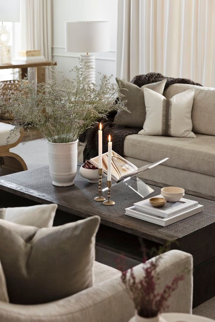 Brass Candlesticks Add Warmth To A Layered Book Display