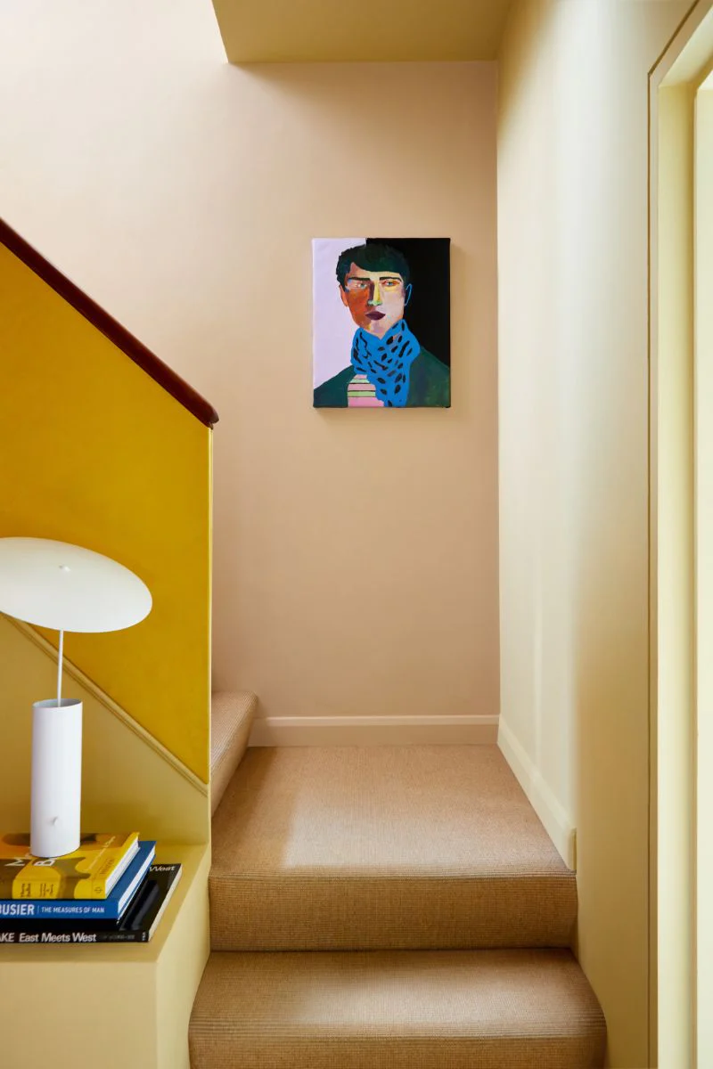 Bold Portrait Art Adds Unexpected Colour To Neutral Hallway