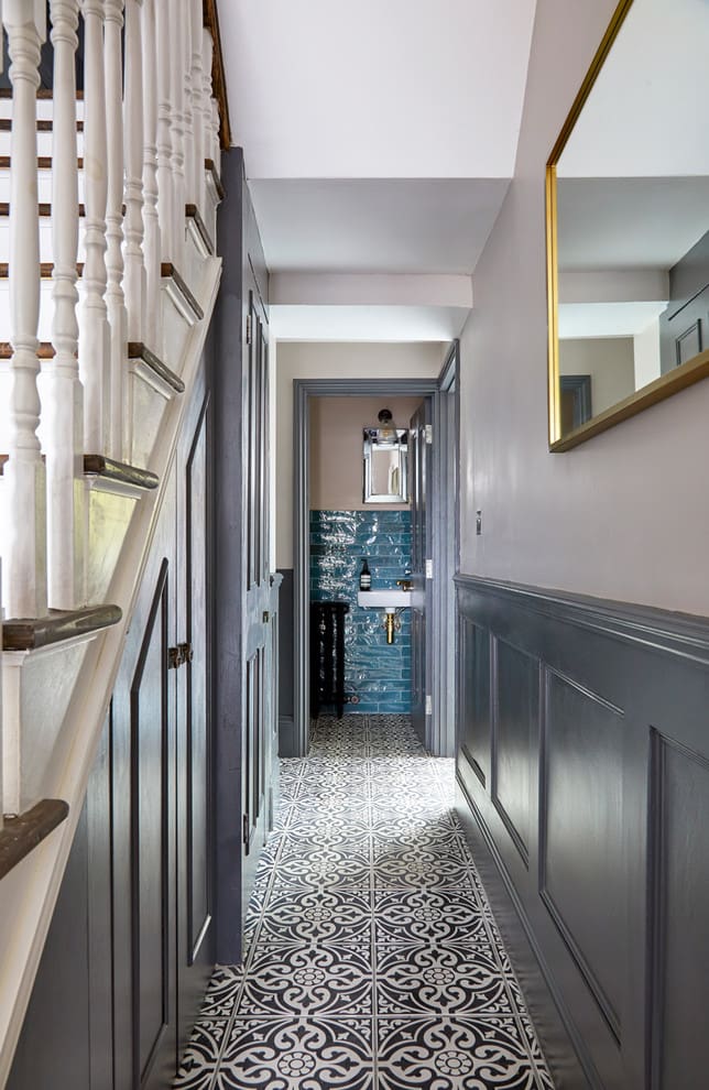 Deep Blue Tiles Create a Striking Accent in a Narrow Hallway