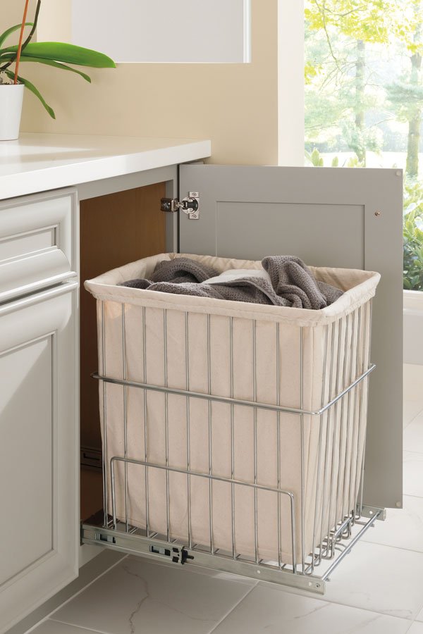 Pull-Out Hamper Hides Laundry Behind Cabinet Door
