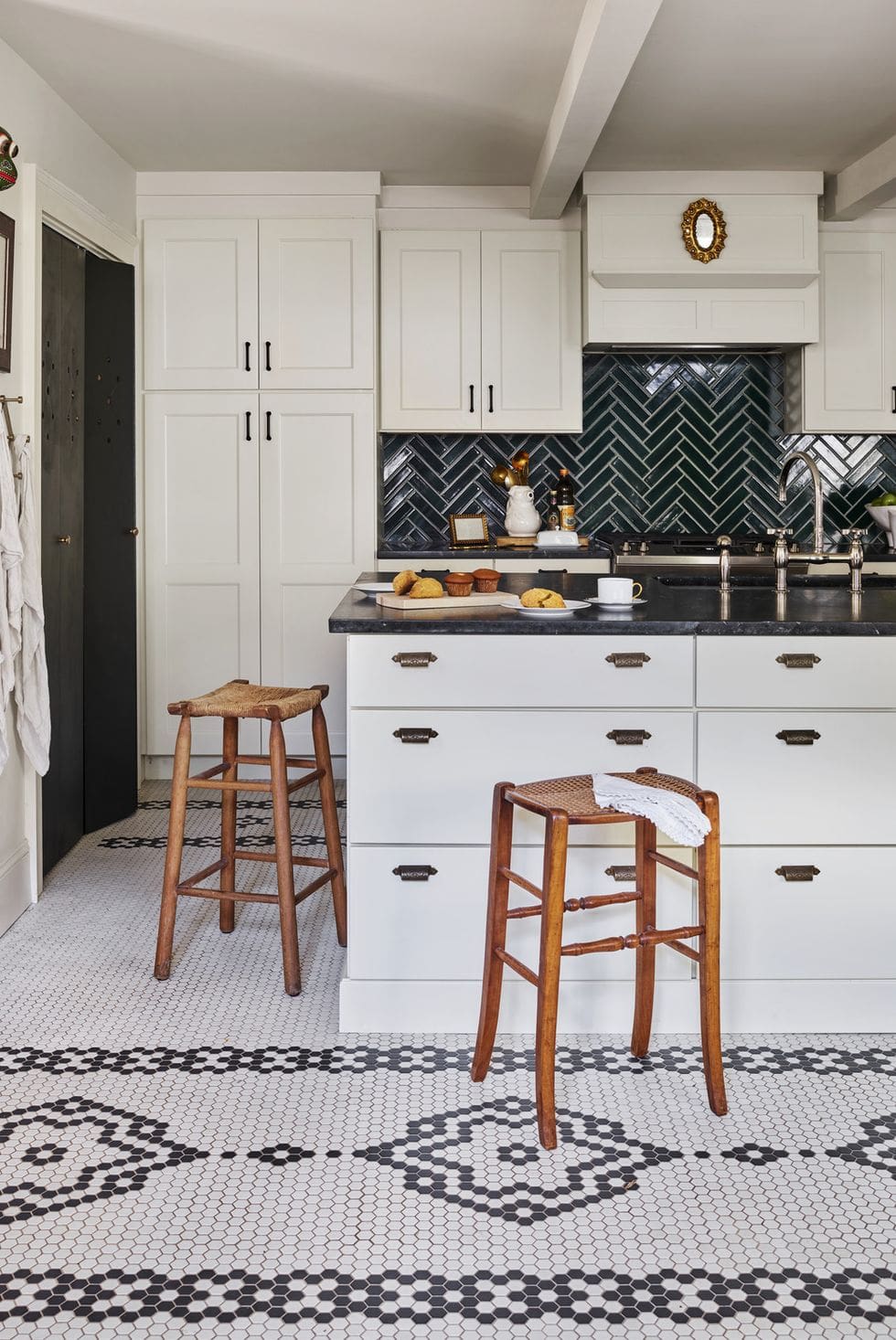Dark Green Herringbone Tile Backsplash Adds Depth Behind White Cabinets