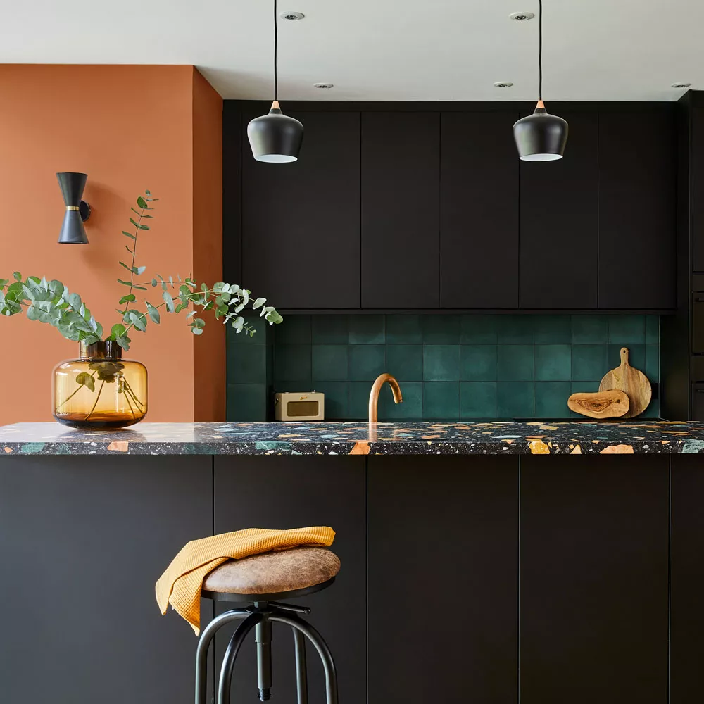 Terracotta Accent Wall Adds Warmth to a Modern Kitchen